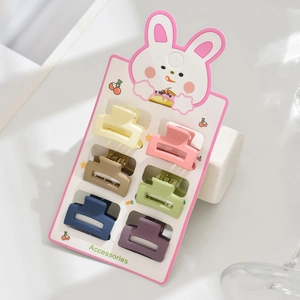 Lot de 6 mini-pinces à cheveux mates aux couleurs pastel sur une carte lapin