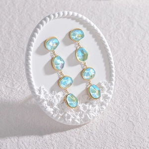 Bohemian light blue faceted stone drop earrings with elegant gold plated metal frame