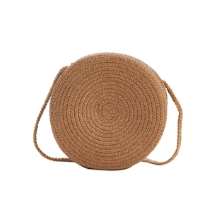 Mini round woven straw crossbody beach bag with thin shoulder strap and zipper closure