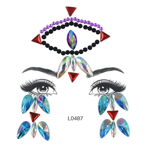 Close-up of L0487 face gem stickers with purple, black and blue rhinestones for eyes