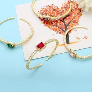 Detail of luxury open bangles with rectangular cubic zirconia in multiple vibrant colors