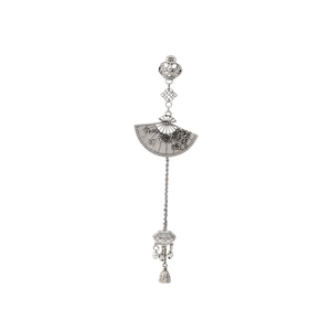 Detailed close-up of a silver vintage fan-shaped brooch with traditional Chinese tassels