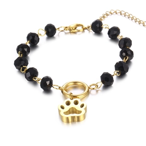 Beaded bracelet with black faceted crystal beads and golden cat paw charm pendant