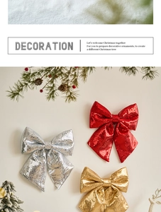 Close-up of sparkling Christmas bows in red, gold and silver with sequins and pine cones