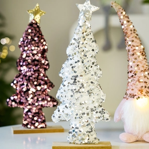Pink Christmas gnome with glowing nose and sequin trees on wooden bases for desk decor