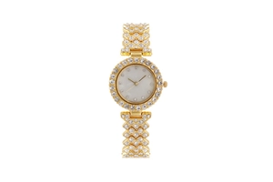 Close-up of golden women's watch featuring a crystal-set bezel and white mother of pearl dial
