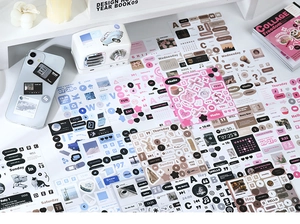 Close-up of vintage aesthetic DIY scrapbooking stickers with letters and calendars
