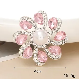 Pink crystal flower brooch with central pearl and rhinestone petals, 4cm diameter