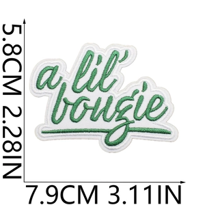 Embroidered 'a lil' bougie' patch in green thread on white fabric, 7.9 x 5.8 cm size