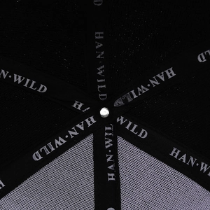 Detail view of the tactical cap interior showing breathable mesh and logo tape