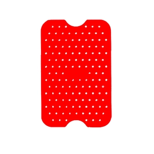 Detail of red silicone air fryer liner with white polka dots for dual basket models