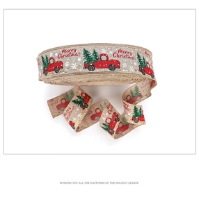 Detail of Christmas burlap ribbon with vintage red truck and green tree pattern printing