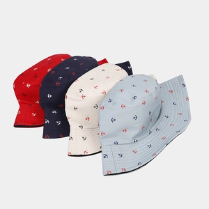 Detail of four anchor-print cotton bucket hats in red, navy, beige and light blue