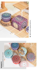 Detail of colorful Mandala tin scented candles and boxes on natural wood decor