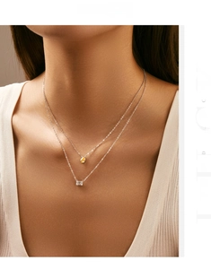 Detailed view of s925 silver double layer necklace with pear and rectangular gemstone