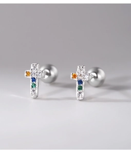 Macro view of sterling silver cross earrings with colorful zircon and screw backs