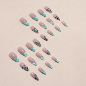 Almond-shaped French press-on nails with mint green butterfly patterns and gold glitter