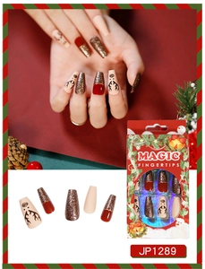Detailed view of Christmas press on nails with reindeer patterns and festive gift box
