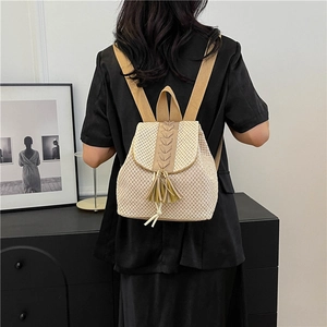 Beige straw woven backpack with khaki tassels and drawstring closure for women
