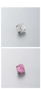Macro shot of F136 titanium stud earrings with round-cut clear and pink cubic zirconia