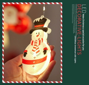 Detail of LED painted snowman Christmas hanging light with festive glowing effect