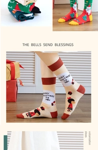 Close-up of 4-pack Christmas cotton socks with Santa and snowman patterns in a gift box