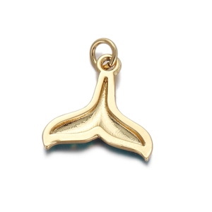 Macro view of gold whale tail charm pendant with polished metal finish and jump ring