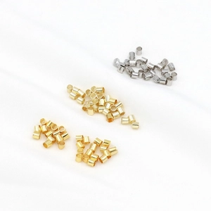 Detailed macro view of 18K gold and silver plated metal spacer beads for DIY jewelry making