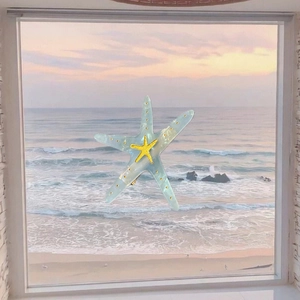 Macro view of mint green pearl starfish hair clip with a golden shell centerpiece