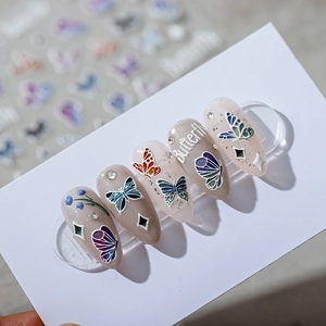 5D butterfly nail stickers with 3D embossed texture and sparkling rhinestones