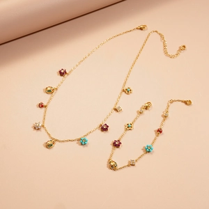Golden necklace and bracelet set with colorful zircon ladybug and flower charms