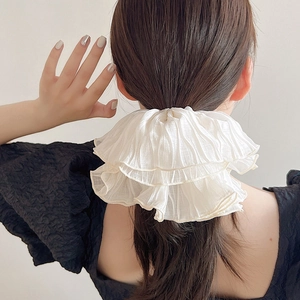 Oversized ruffled cream hair scrunchie in soft chiffon fabric for elegant hairstyles