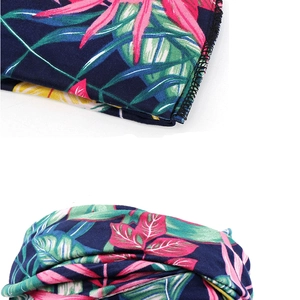 Detailed stitching and vibrant tropical plant print on elastic bohemian headband fabric