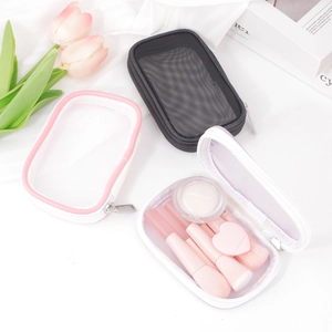 Three minimalist mesh makeup bags for travel storage in black, pink, and purple colors
