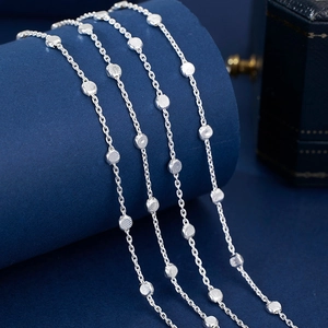 Elegant 925 sterling silver beaded chain necklace displayed on a dark blue stand