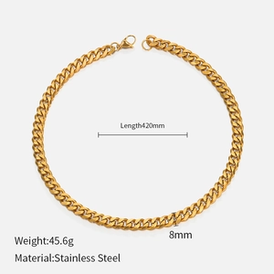 Flat lay of gold stainless steel Cuban chain necklace with dimensions and weight specs