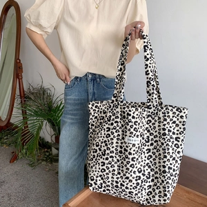 Detail of leopard print canvas tote bag featuring Korean label and spacious interior
