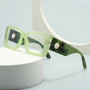 Modern oversized square sunglasses with translucent green frame and marble pattern temples