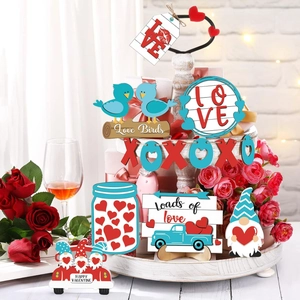 Detail view of Valentine's Day tiered tray decor with wooden heart signs and trucks