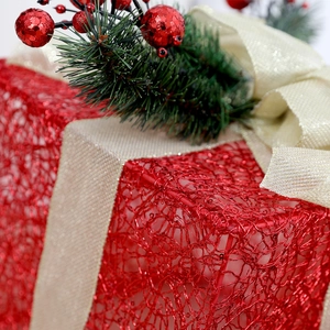 Lighted red mesh Christmas gift box with champagne gold bow and pine needle decor