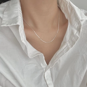 Elegant 925 sterling silver square pendant necklace worn over a crisp white shirt