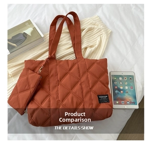 Flat lay of quilted brick red nylon tote bag with matching small pouch on white background