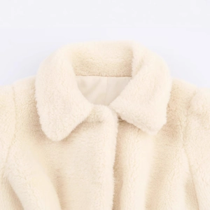 Chic cream faux fur jacket for women featuring a warm lapel collar and waist tie belt
