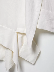Detailed macro view of white linen blend fabric with visible plain weave texture