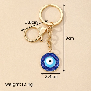 Golden alloy Evil Eye keychain with blue resin charm and lobster clasp for bag decoration