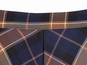 Detail shot of the precise stitching and premium plaid fabric of this fashion skirt