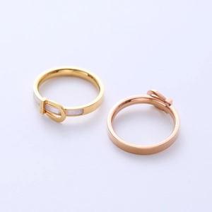 Minimalist belt buckle ring in gold and rose gold with inlaid white shell detail