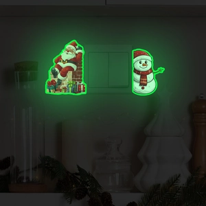 Glow-in-the-dark Santa Claus and Snowman wall stickers around a bedroom light switch