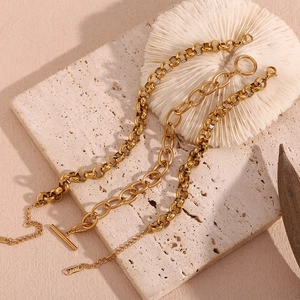 Detailed macro view of 18K gold-plated stainless steel chains with OT buckle and K18 stamp