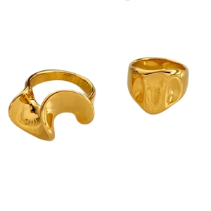 Elegant gold plated wavy ring with irregular fluid design in polished stainless steel